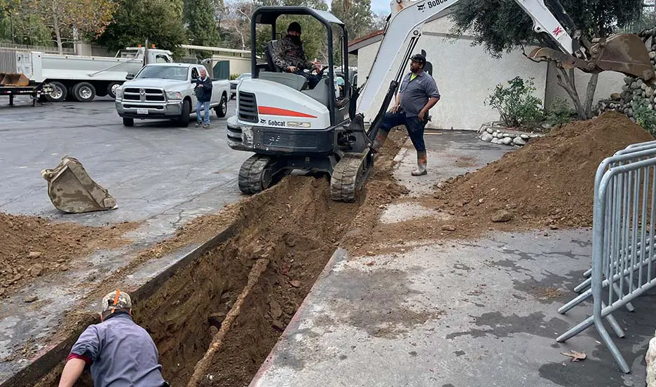 worker replacing gas and water pipes