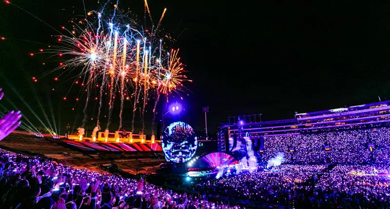 fireworks over a packed stadium